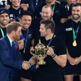 Prince Harry presents New Zealand captain Richie McCaw with the Webb Ellis Trophy after the All Blacks' victory over Australia in the 2015 Rugby World Cup final at Twickenham. Picture: Mike Egerton/PA Wire