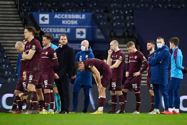 A dejected Hearts squad after the full-time whistle. Picture: SNS