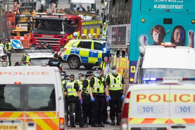 Police attend the scene of a fatal stabbing incident at the Park Inn Hotel in central Glasgow on June 26, 2020.