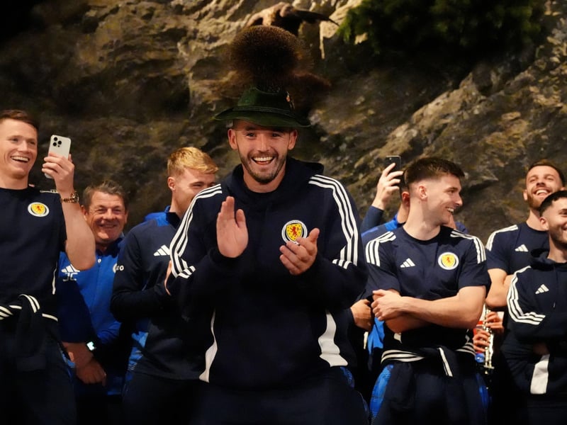 Scotland's John McGinn (centre) joins in with a dance as the team arrive at Bayernhalle in Garmisch-Partenkirchen, Germany, for a reception hosted by the Mayor.