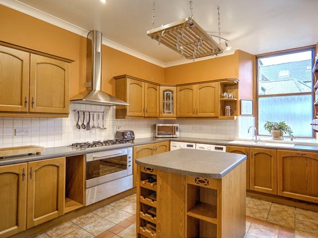 The house has a farmhouse style kitchen with plenty of storage