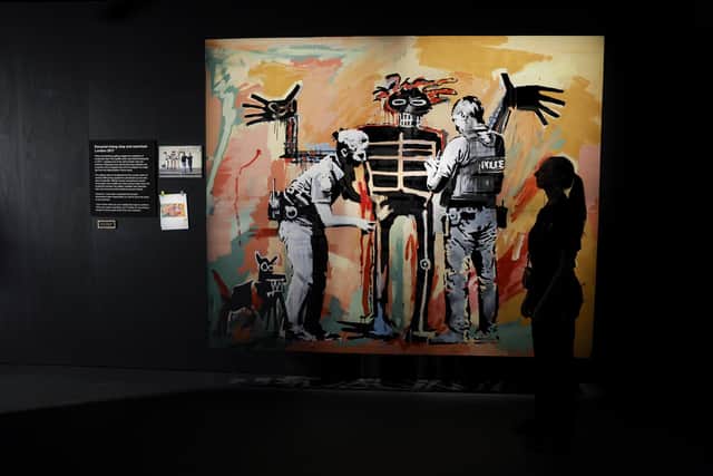 Basquiat being stop and searched by Banksy at Glasgow's GoMA PIC: Jeff J Mitchell/Getty Images