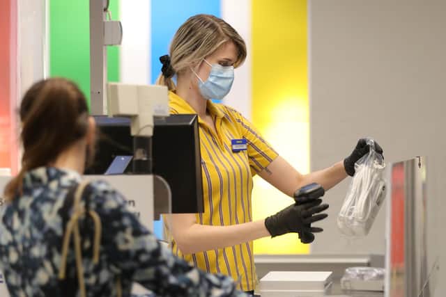 IKEA staff wearing protective masks. Picture Getty