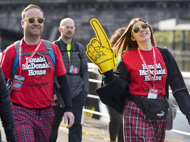 Kiltwalkers head along the River Clyde