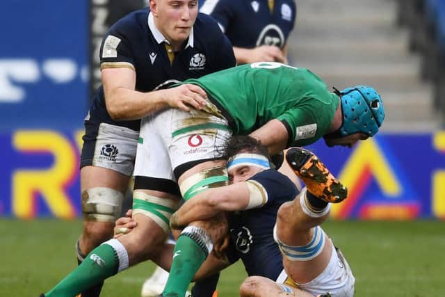 Ireland's Tadhg Beirne is tackled by Jamie Ritchie and Matt Fagerson during the Guinness Six Nations match between Scotland and Ireland at BT Murrayfield, on March 14 in Edinburgh, Scotland.  (Photo by Ross MacDonald / SNS Group)