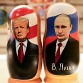 Traditional Russian wooden nesting dolls depicting Russia's President Vladimir Putin and US President Donald Trump in downtown Moscow (Picture: Tatyana Makeyeva/Getty Images)