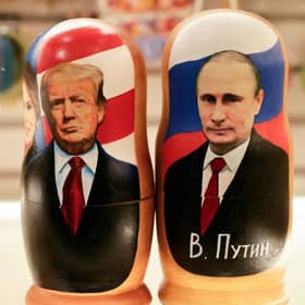 Traditional Russian wooden nesting dolls depicting Russia's President Vladimir Putin and US President Donald Trump in downtown Moscow (Picture: Tatyana Makeyeva/Getty Images)