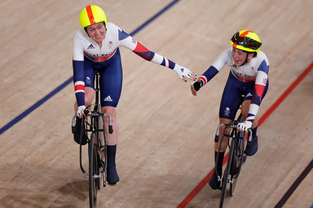 Britain's Katie Archibald, left, and Laura Kenny celebrate after winning in the Olympic Madison final at Izu Velodrome. Picture: Odd Andersen/AFP via Getty Images