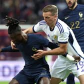 Lewis Ferguson battles with France's Eduardo Camavinga during the 4-1 defeat for Scotland.