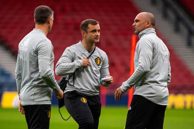 Shaun Maloney (centre) in conversation with Roberto Martinez (right) during his time as assistant manager of the Belgian national team. (Photo by Alan Harvey / SNS Group)