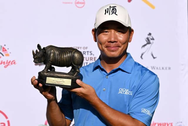 Ashun Wu of China poses with the Magical Kenya Open after his four-shot win at Muthaiga Golf Club. Picture: Stuart Franklin/Getty Images.