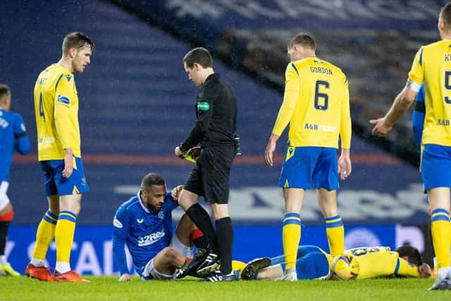 Rangers' Kemar Roofe (L) is booked for a challenge on St Johnstone's Murray Davidson during the Scottish Premiership match between Rangers and St Johnstone at Ibrox Stadium, on February 03, 2021, in Glasgow, Scotland. (Photo by Alan Harvey / SNS Group)