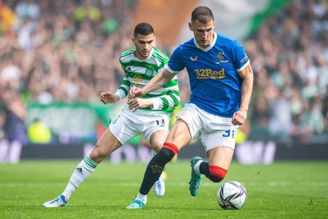 Rangers defender Borna Barisic (right), pictured shielding the ball from Celtic winger Liel Abada during last Sunday's Scottish Cup semi-final at Hampden, says the Ibrox club have not given up hope of retaining the Premiership title. (Photo by Ross MacDonald / SNS Group)