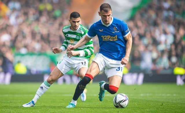 Rangers defender Borna Barisic (right), pictured shielding the ball from Celtic winger Liel Abada during last Sunday's Scottish Cup semi-final at Hampden, says the Ibrox club have not given up hope of retaining the Premiership title. (Photo by Ross MacDonald / SNS Group)