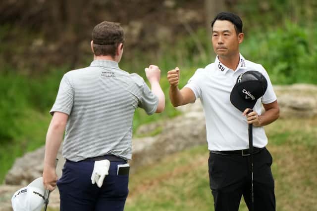 Bob MacIntyre fist bumps Kevin Na after winning their match at Austin Country Club in Texas. Picture: Darren Carroll/Getty Images.