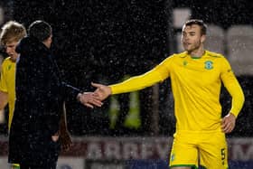 Hib's Ryan Porteous celebrates with his manager Jack Ross after the Easter Road side's victory over St Mirren. Photo by Ross Parker / SNS Group