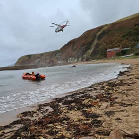Rescue teams helped get the injured man to safety. Pic: Dunbar RNLI