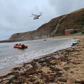 Rescue teams helped get the injured man to safety. Pic: Dunbar RNLI
