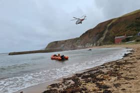 Rescue teams helped get the injured man to safety. Pic: Dunbar RNLI