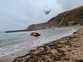 Rescue teams helped get the injured man to safety. Pic: Dunbar RNLI