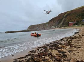 Rescue teams helped get the injured man to safety. Pic: Dunbar RNLI