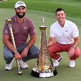 Jon Rahm and Rory McIlroy of Northern Ireland with their trophies after the final round of the DP World Tour Championship on the Earth Course at Jumeirah Golf Estates in Dubai earlier this month. Picture: Ross Kinnaird/Getty Images.