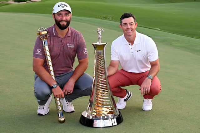 Jon Rahm and Rory McIlroy of Northern Ireland with their trophies after the final round of the DP World Tour Championship on the Earth Course at Jumeirah Golf Estates in Dubai earlier this month. Picture: Ross Kinnaird/Getty Images.