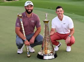 Jon Rahm and Rory McIlroy of Northern Ireland with their trophies after the final round of the DP World Tour Championship on the Earth Course at Jumeirah Golf Estates in Dubai earlier this month. Picture: Ross Kinnaird/Getty Images.