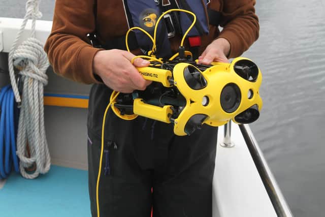 Chris Rickard, essential fish habitat officer for Open Seas,  with the underwater drone. Picture: Nick Underdown