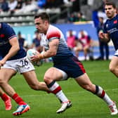 Ross McCann in action for Great Britain against France's Rayan Rebbadj and Antoine Dupont during the HSBC Rugby Sevens LA tournament in Carson, California on March 2, 2024.  (Photo by PATRICK T. FALLON/AFP via Getty Images)