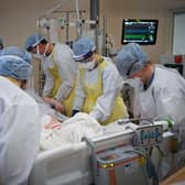 NHS staff attend to a Covid patient in University Hospital Monklands earlier this year (Picture: Jeff J Mitchell/Getty Images)