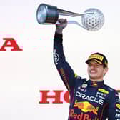Race winner and 2022 F1 World Drivers Champion Max Verstappen of the Netherlands and Oracle Red Bull Racing celebrates on the podium during the F1 Grand Prix of Japan at Suzuka International Racing Course.