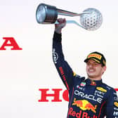 Race winner and 2022 F1 World Drivers Champion Max Verstappen of the Netherlands and Oracle Red Bull Racing celebrates on the podium during the F1 Grand Prix of Japan at Suzuka International Racing Course.