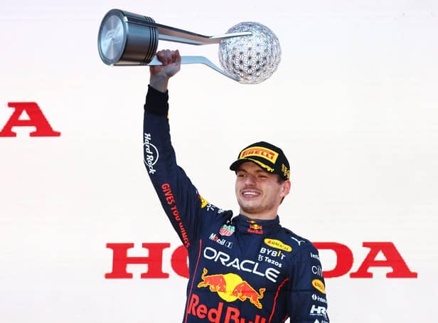 Race winner and 2022 F1 World Drivers Champion Max Verstappen of the Netherlands and Oracle Red Bull Racing celebrates on the podium during the F1 Grand Prix of Japan at Suzuka International Racing Course.