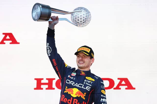 Race winner and 2022 F1 World Drivers Champion Max Verstappen of the Netherlands and Oracle Red Bull Racing celebrates on the podium during the F1 Grand Prix of Japan at Suzuka International Racing Course.
