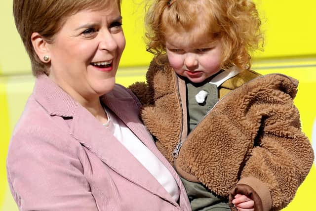 Scottish First Minister and leader of the Scottish National Party Nicola Sturgeon holds Saoirse, the daughter of SNP candidate for Edinburgh Central Angus Robertson in Edinburgh, during campaigning. Picture: Russell Cheyne/PA Wire