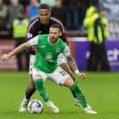 Hibs' Martin Boyle tries to evade the clutches of Hearts' Toby Sibbick at Tynecastle.