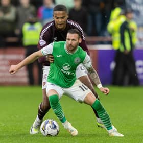 Hibs' Martin Boyle tries to evade the clutches of Hearts' Toby Sibbick at Tynecastle.