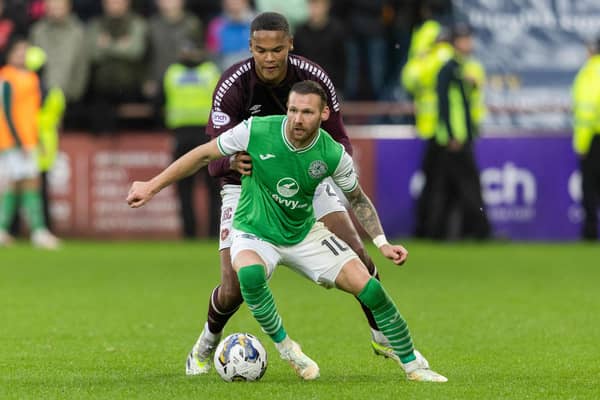 Hibs' Martin Boyle tries to evade the clutches of Hearts' Toby Sibbick at Tynecastle.