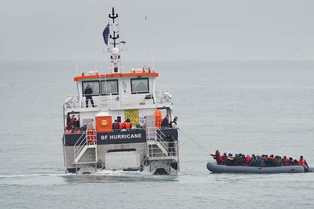 A group of people thought to be migrants are rescued off the coast of Folkestone, Kent