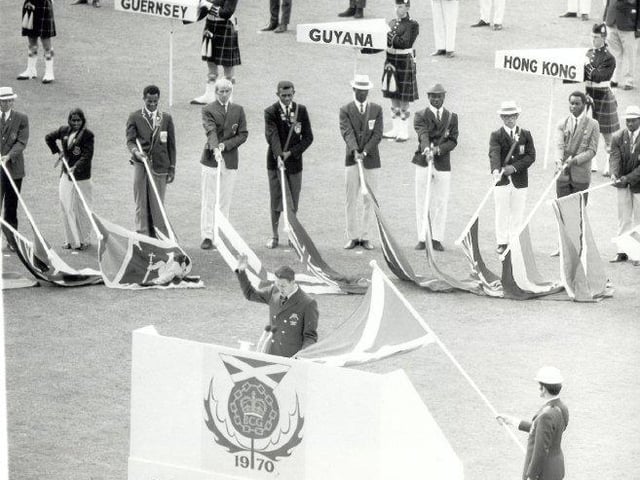 The participating countries' flags arrive in the stadium at the 1970 Opening Ceremony.