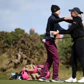 World No 1 Nelly Korda and 2023 runner-up Charley Hull embrace on the ninth green at the end of their second round in the AIG Women's Open at St Andrews. Picture: Ross Parker/R&A/R&A via Getty Images.