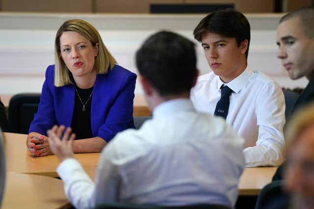 Education Secretary Jenny Gilruth chats to pupils during a visit to Craigmount High School in Edinburgh to mark SQA Results Day 2023. Andrew Milligan/PA Wire