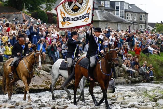 Riders cross the River Esk during the Langholm Common Riding, 29 July 2022. An equestrian tradition where men and women ride out of the town and along its borders, the event commemorates the period when there were frequent raids on both sides of Anglo-Scottish border. PIC: Jeff J Mitchell/Getty Images