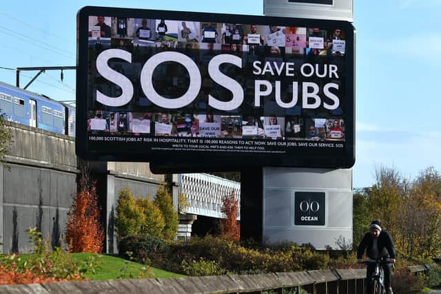 A 'SOS Save our Bars' billboard campaign bids to save Glasgow jobs. Picture: John Devlin