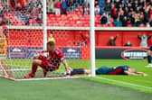 Aberdeen's Christian Ramirez scores and equaliser late on to make it 1-1 during a cinch Premiership match against Ross County at Pittodrie.