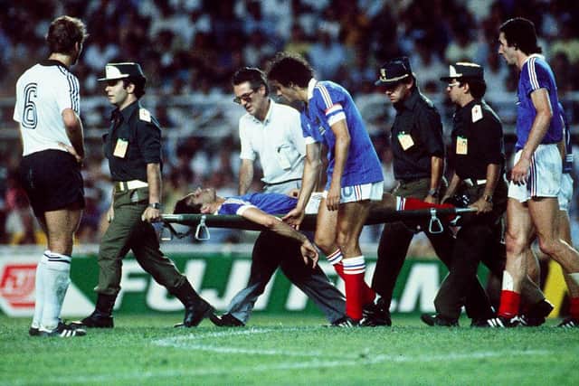 Patrick Battiston had to be stretchered off after being floored by Harald Schumacher. (Photo by -/AFP via Getty Images)