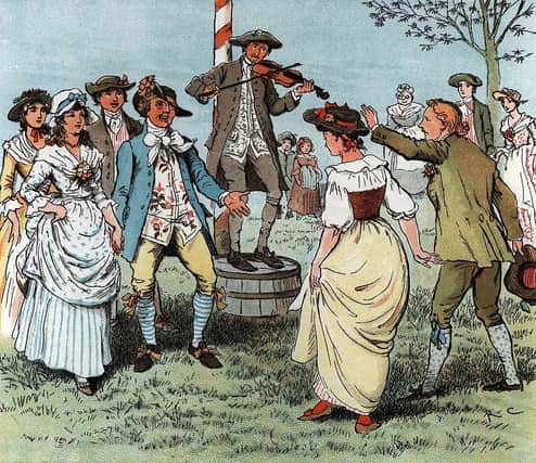 May 1780:  Couples dance around the Maypole to tunes played on the fiddle (Photo: Hulton Archive/Getty Images)