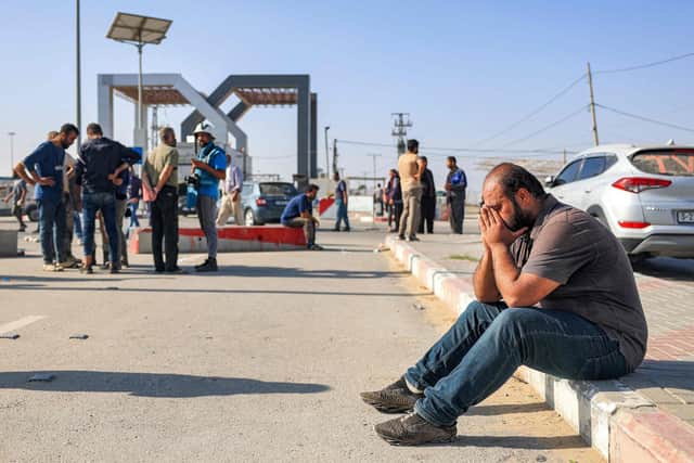 A man reacts as he sits near the gate to the Rafah border crossing with Egypt in the south of the Gaza Strip. Picture: Said Khatib/AFP via Getty Images
