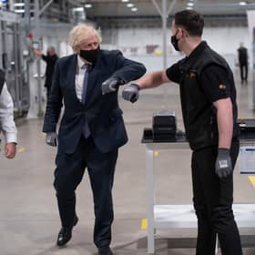 Britain's Prime Minister Boris Johnson tours the facility with managing director Jeff Pratt (left) as he meets a member of staff during a visit to the UK Battery Industrialisation Centre in Coventry. Picture: AFP via Getty Images






West Midlands.
15th July 2021 (Photo by David Rose / POOL / AFP) (Photo by DAVID ROSE/POOL/AFP via Getty Images)